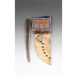 A Cree style part beaded knife sheath rawhide, brass studs, tin cones, cotton and coloured glass