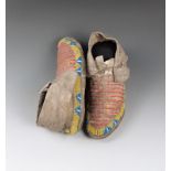 A pair of Sioux woman's moccasins buckskin, quill and coloured glass beads, with thirteen rows of