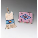 A Plains ration ticket pouch white buckskin and coloured glass beads, with a light blue ground