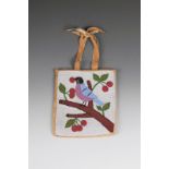 A Plateau beaded bag Western North America buckskin with a front panel of a bird in a cherry tree,