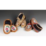 Three pairs of North American moccasins buckskin, glass beads and cloth, including an Iroquois