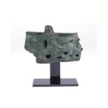 An Elamite bronze vessel rim fragment circa 2nd millennium BC with a cast stylised recumbent bull