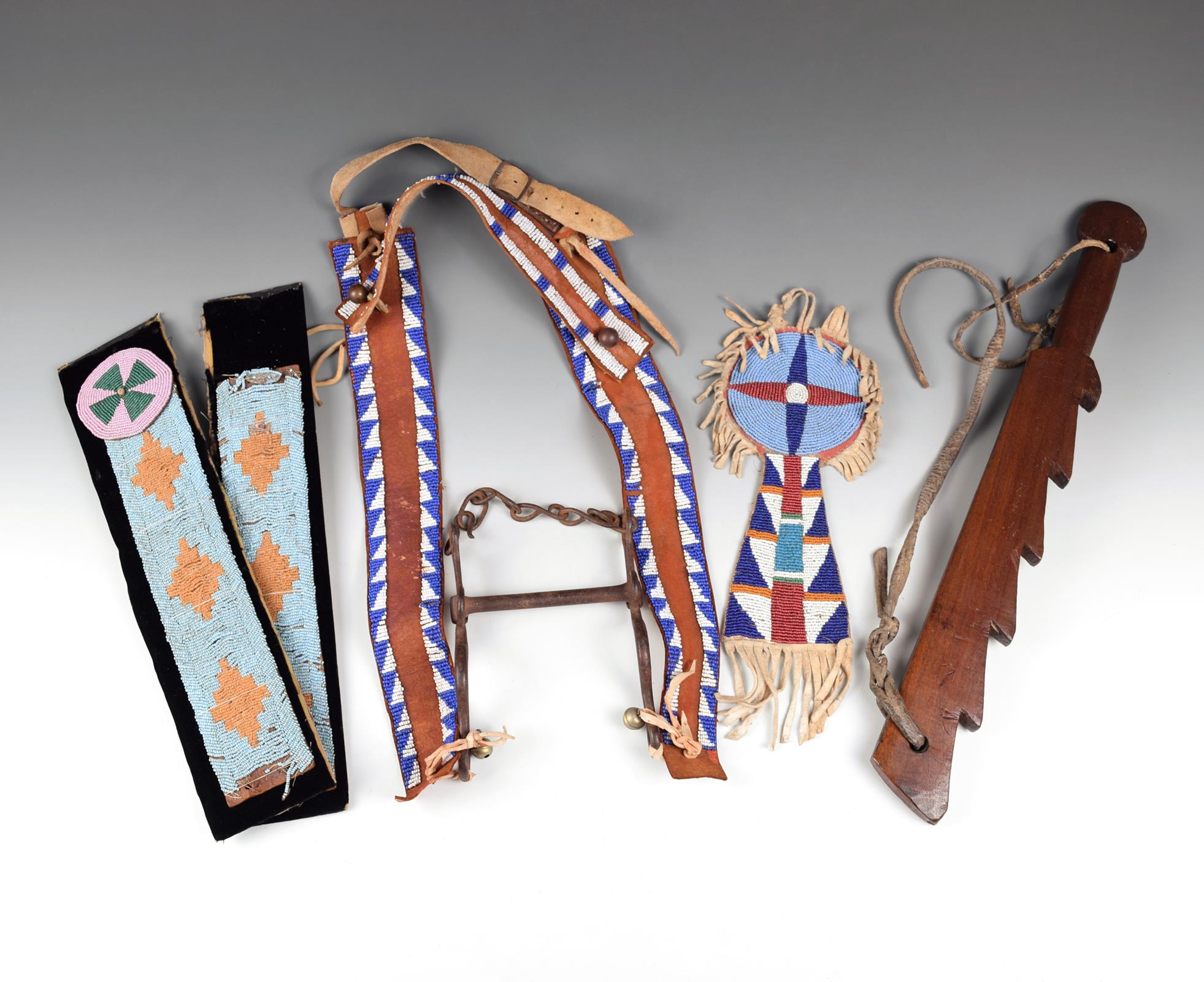 A Crow horse forehead ornament hide and glass beads, of keyhole shape, the top with a four point