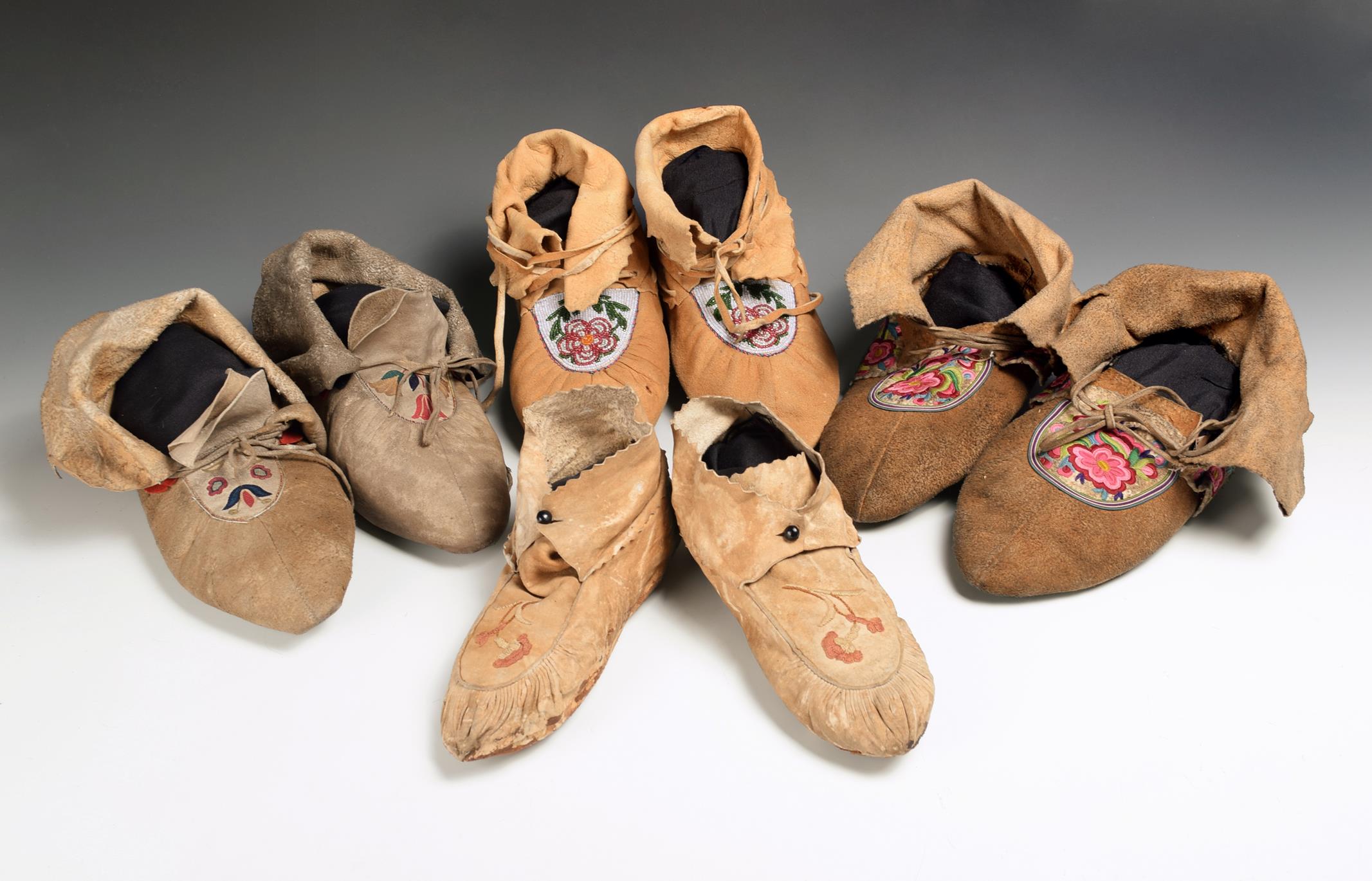 Two Cree moccasins late 19th century, hide with fine floral embroidered vamps with split quill
