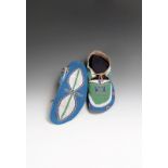 A pair of Assiniboine fully beaded moccasins buckhide with green, white, light and dark blue, red