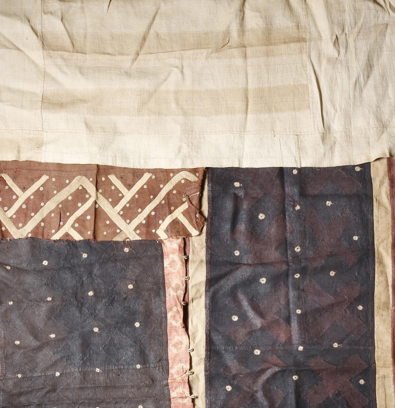 Four Kuba textiles Democratic Republic of Congo including a long cloth of plain fibre panel, 525cm x