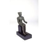 An Egyptian bronze seated figure of Amun Third Intermediate Period, 21st - 24th Dynasty, 1069 -