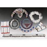 A Zulu beaded waistband South Africa white with black geometric designs, a blue edge and with a