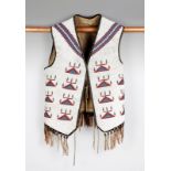 A Plains beaded vest canvas, coloured glass beads, faceted steel beads, buckskin and brass beads,