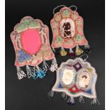 Three Iroquois picture frame whimsies cloth and glass beads, two with raised foliage and fringes,