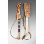 A Plains style quirt or riding whip elk horn with a fur wrist strap and a braided leather lash, 32cm