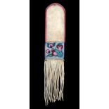 An Ojibwe pipe bag buckskin, coloured glass beads, cloth and bells, with floral decorated panels,