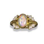 An Art Nouveau opal and enamel ring by René Lalique, c1900, the solid white opal cabochon set within