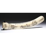 λ An ivory scrimshaw letter opener, with a clenched fist handle, one side polychrome decorated