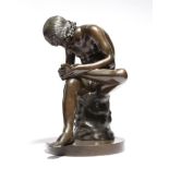 After the antique. A 19th century Italian bronze model of Spinario, 32.5cm high.