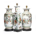 A pair of Chinese porcelain famille verte vases, converted into table lamps, painted with ladies