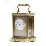 A late 19th century French gilt brass carriage clock, the eight day movement with a platform lever