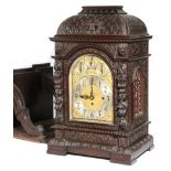 A large late Victorian carved mahogany Westminster chiming bracket clock, the eight day three