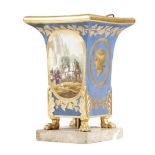 A late 19th century Paris porcelain jardinière, of square section, decorated in gilt on a blue