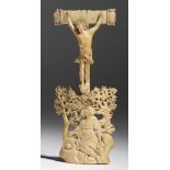 λ A German carved ivory Corpus Christi mount, of curved form, depicting Jesus on the cross above