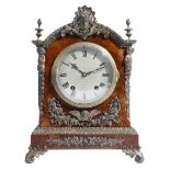 A late Victorian walnut mantel clock, the eight day German movement by Lenzkirch striking on two