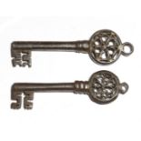 Two 16th century Italian Venetian iron keys, each with a hexafoil Gothic pierced bow, and a ring for