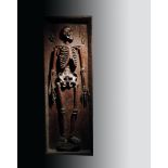 An unusual 19th century South American carved hardwood model of a life size skeleton, adze carved