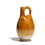 A Chinese ochre glazed pottery pilgrim flask, Liao Dynasty, 23.5cm high.Provenance: Christie's South