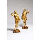 A pair of giltwood figures, of scantily clad maidens, possibly 17th / 18th century and later, on a
