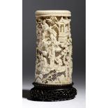 λ A late 19th century Chinese Canton carved ivory tusk vase, with a reticulated ground and decorated