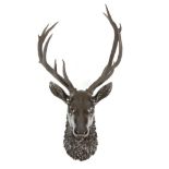 A late 19th century Black Forest carved and painted wood royal stag head mount, applied with a set