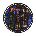 A 13th century and later European stained glass circular panel, probably French, depicting Joachim