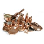 A collection of copper ware, including: two small jelly moulds, a kettle, warmers, a haystack