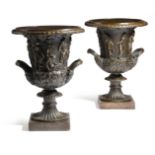 A pair of Italian bronze Grand Tour models of the Borghese vase, of Campana shape, the body cast