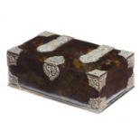 λ A Dutch colonial tortoiseshell casket, with silver plated repoussé mounts and strapwork hinges,