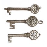 Three 16th century Italian Venetian iron keys, each with a pierced Gothic bow with a ring for
