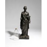 A Regency patinated plaster figural torchère, of a classical maiden personifying summer and