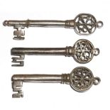 Three 16th century Italian Venetian iron keys, each with a pierced Gothic bow and with a ring for