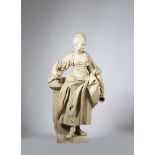 A large 19th century French terracotta figure of a tavern girl, leaning on a tree stump, with a