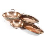 Two Victorian copper dairy bowls, each with a part dipped edge for pouring, with loop handles,