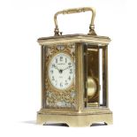 A late 19th century French gilt brass carriage clock, the repeating eight day movement with a