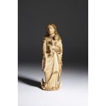 λ An Indo-Portuguese ivory group of the Virgin and child, with parcel gilt decoration and traces