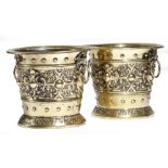 A pair of late 19th century Dutch brass jardinières, each decorated with cartouches, on a