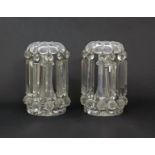 A pair of glass table lustres 19th century, each hung with eleven heavy lustres in two parts from