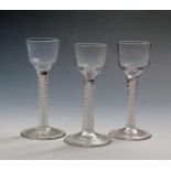 Three small wine glasses c.1760, two with plain ogee bowls, one with moulded vertical flutes to