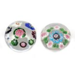 Two miniature Clichy paperweights c.1850, one set with a large Clichy rose within a ring of eight