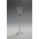 A tall cordial glass c.1770, with drawn trumpet bowl rising from a slender airtwist stem, 22cm.