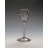 A very rare sealed wine glass c.1760, the rounded funnel bowl applied to two sides with an