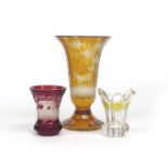 Three Bohemian glass vases 19th century, one flashed in ruby and cut with a bear hunt scene, the