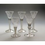 Five Continental wine glasses mid 18th century, three with drawn trumpet bowls variously engraved